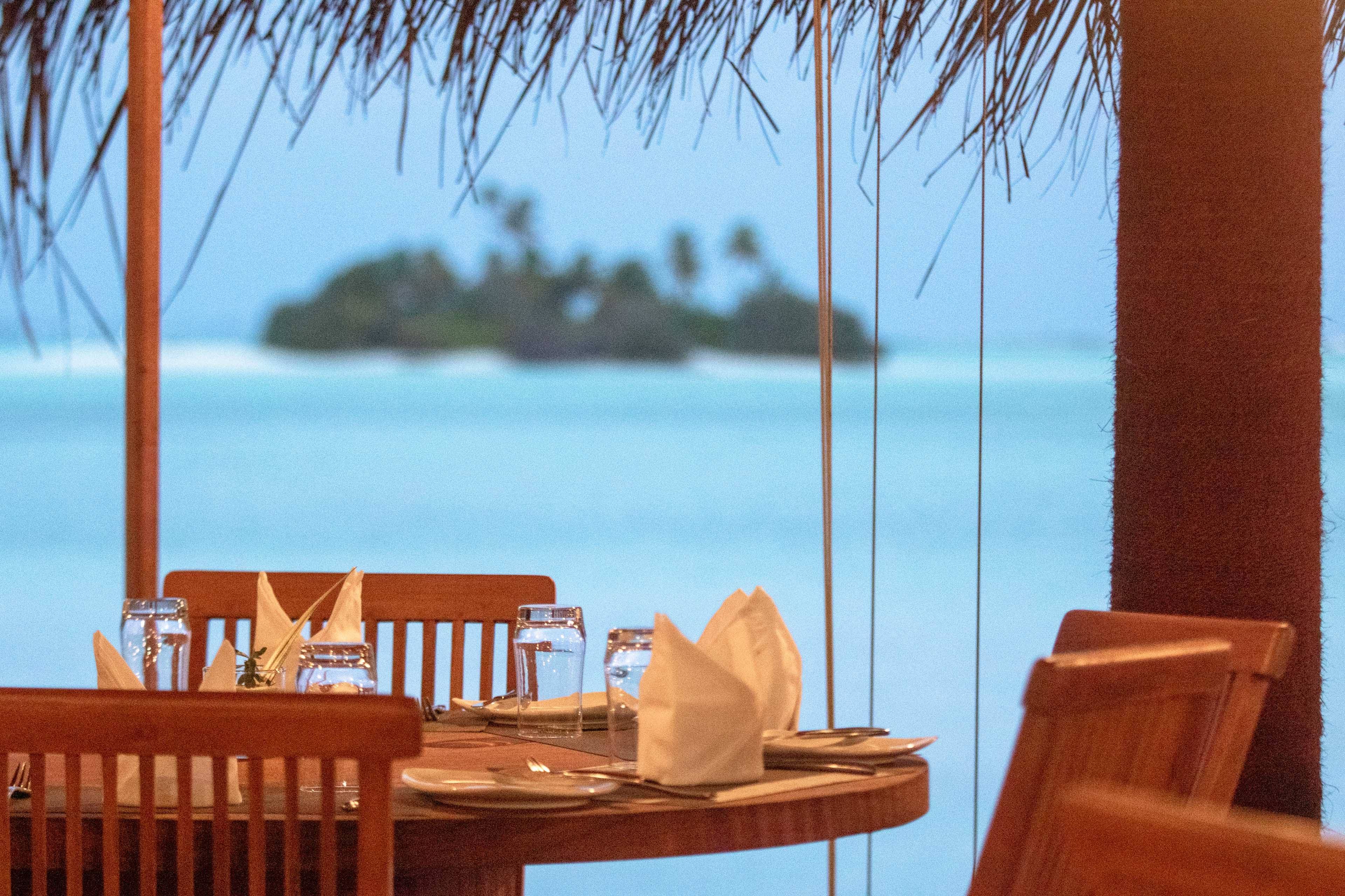 Maldives resort dining and lagoon view, all-inclusive