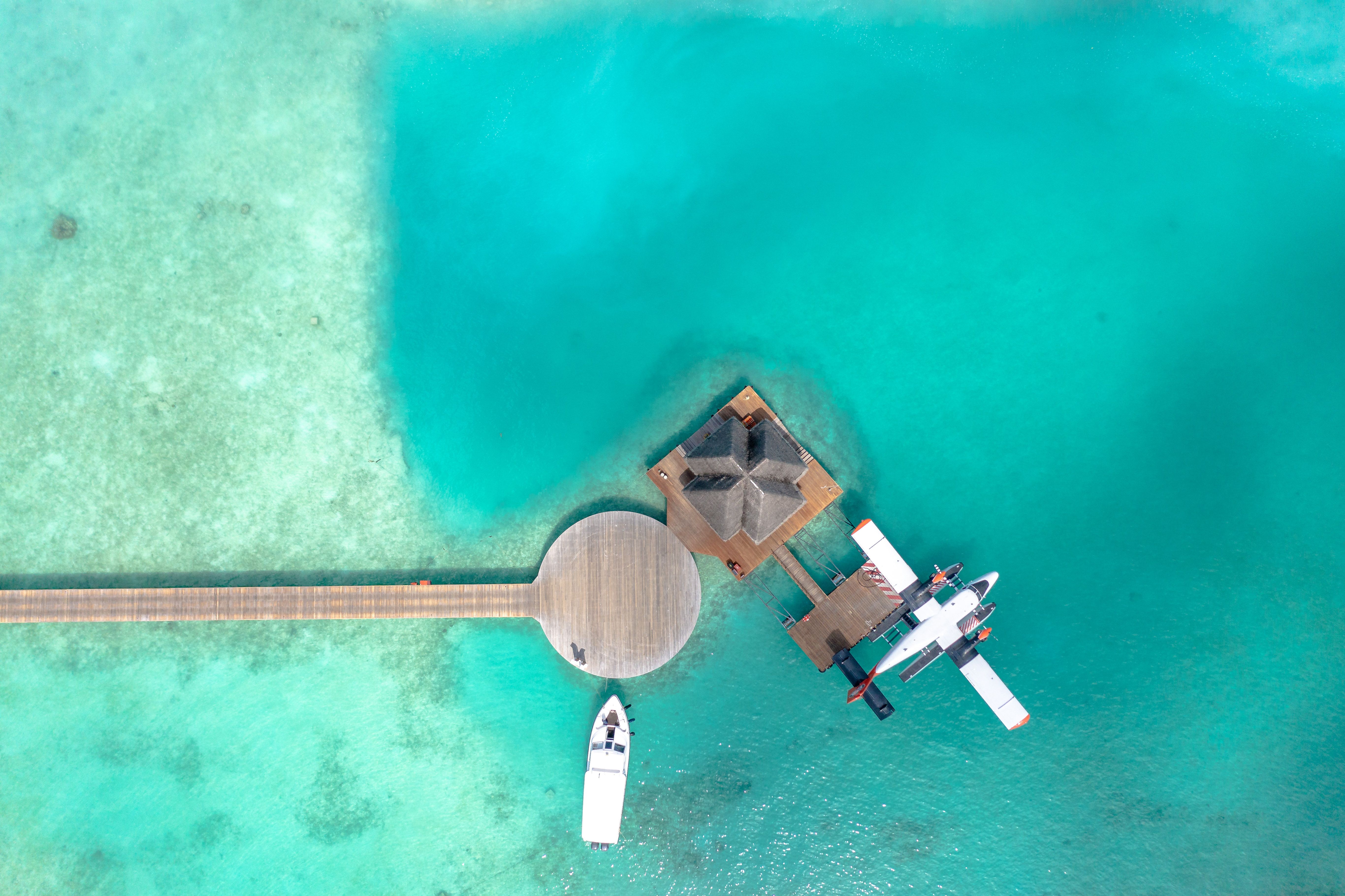 Maldives atoll aerial view showing resort island and lagoon